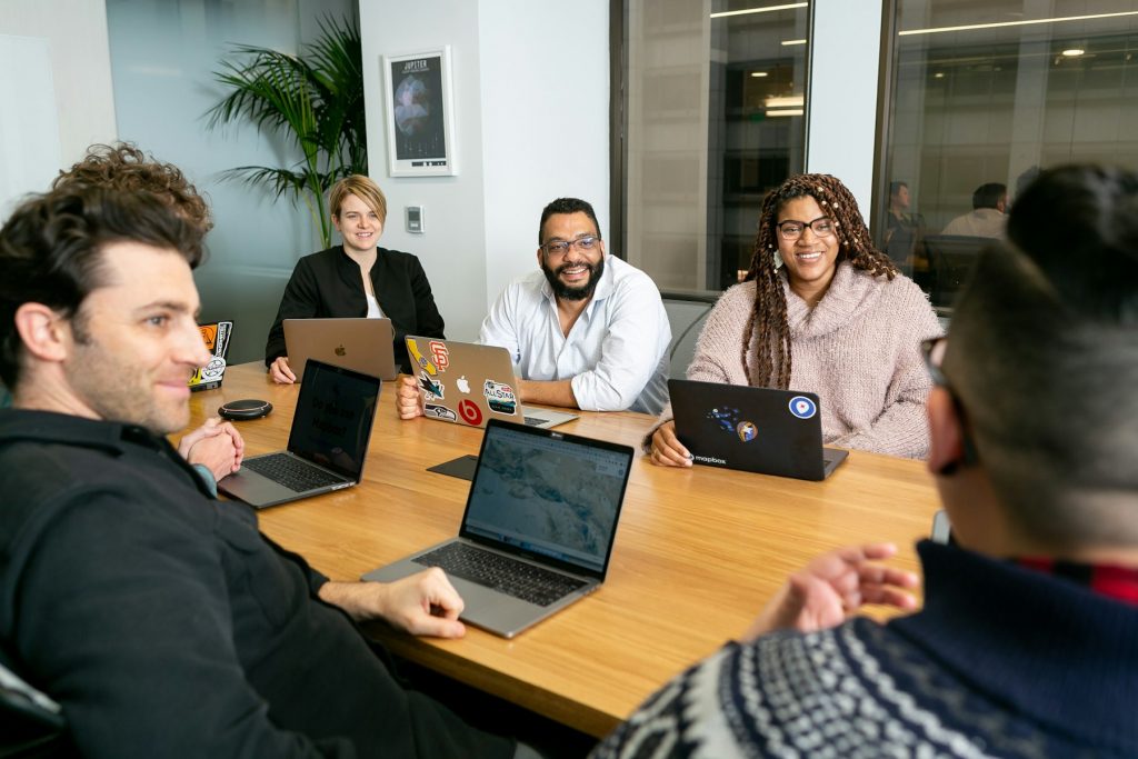 Advisory team discussing governance matters around a table